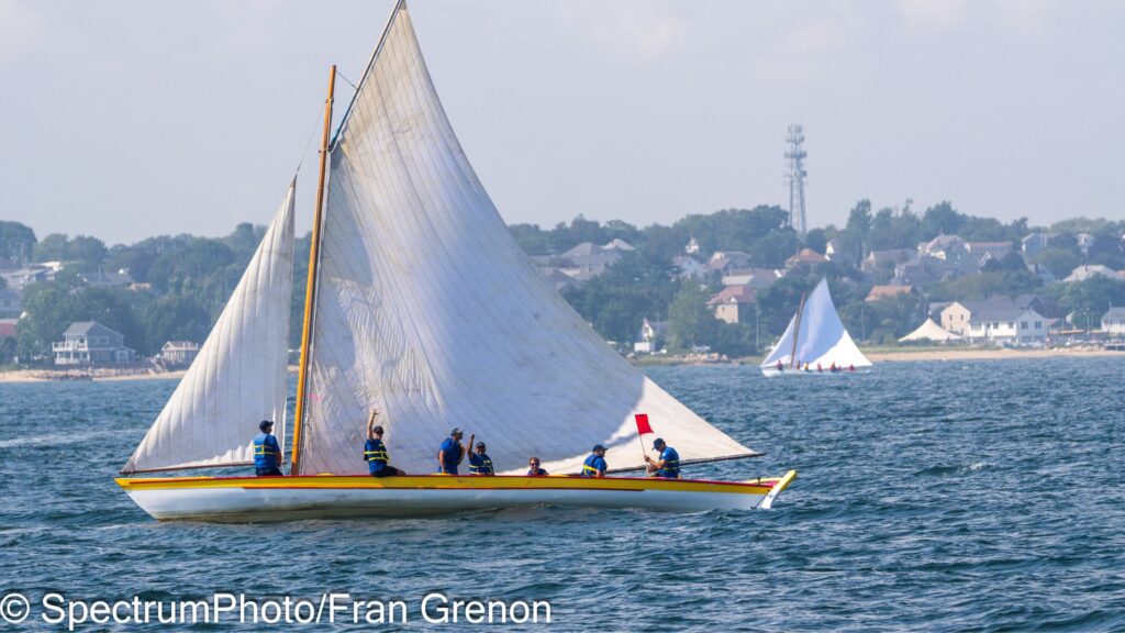A whaleboat sailing in the New Bedford, Massachusetts harbor during the summer.