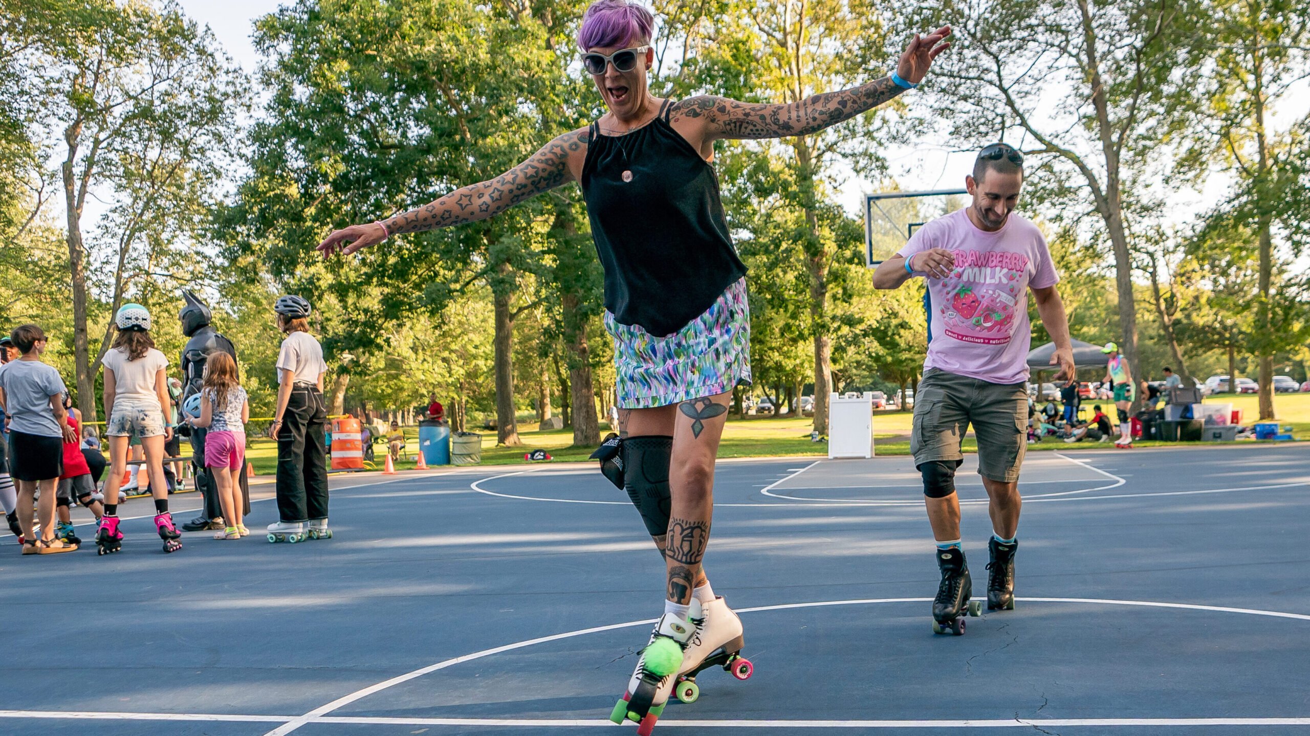 Woman roller skating at the New Moon Roller Disco, an event at Buttonwood Park in August in New Bedford, Massachusetts. 