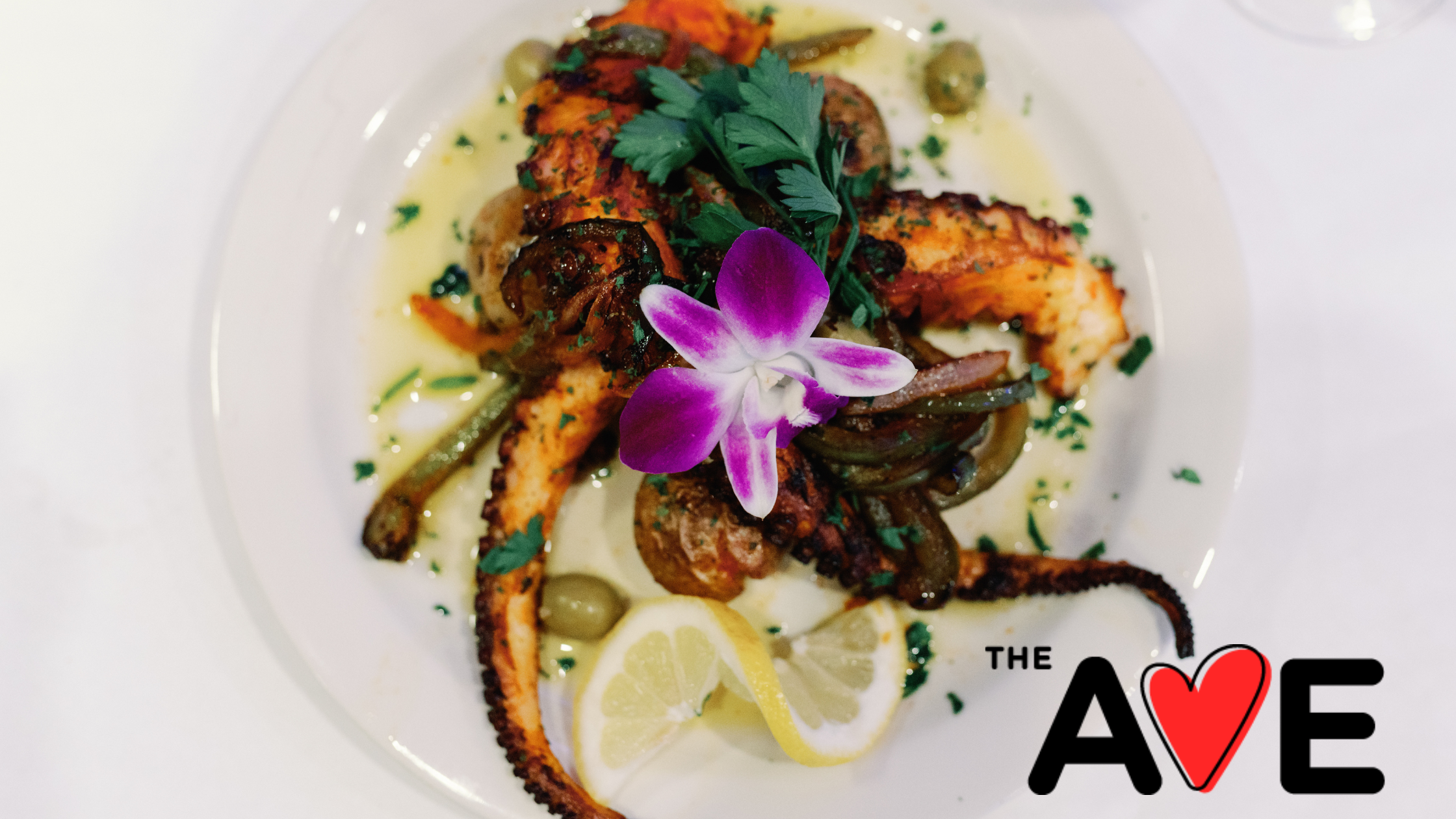 An image of a Cape Verdean octopus dish with the logo for the organization Love the Ave that promotes international culture on Acushnet Avenue New Bedford.