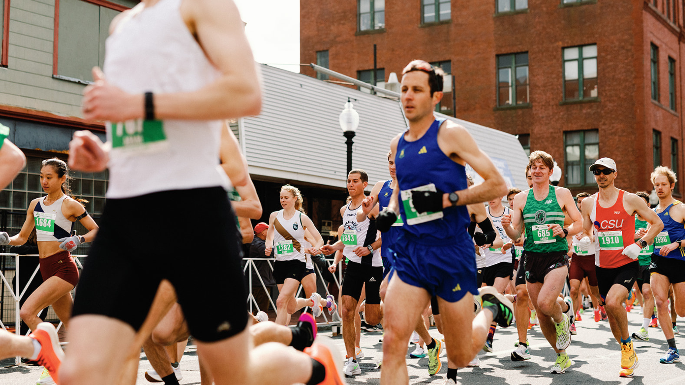 A group of runners start the race at the New Bedford Half Marathon,