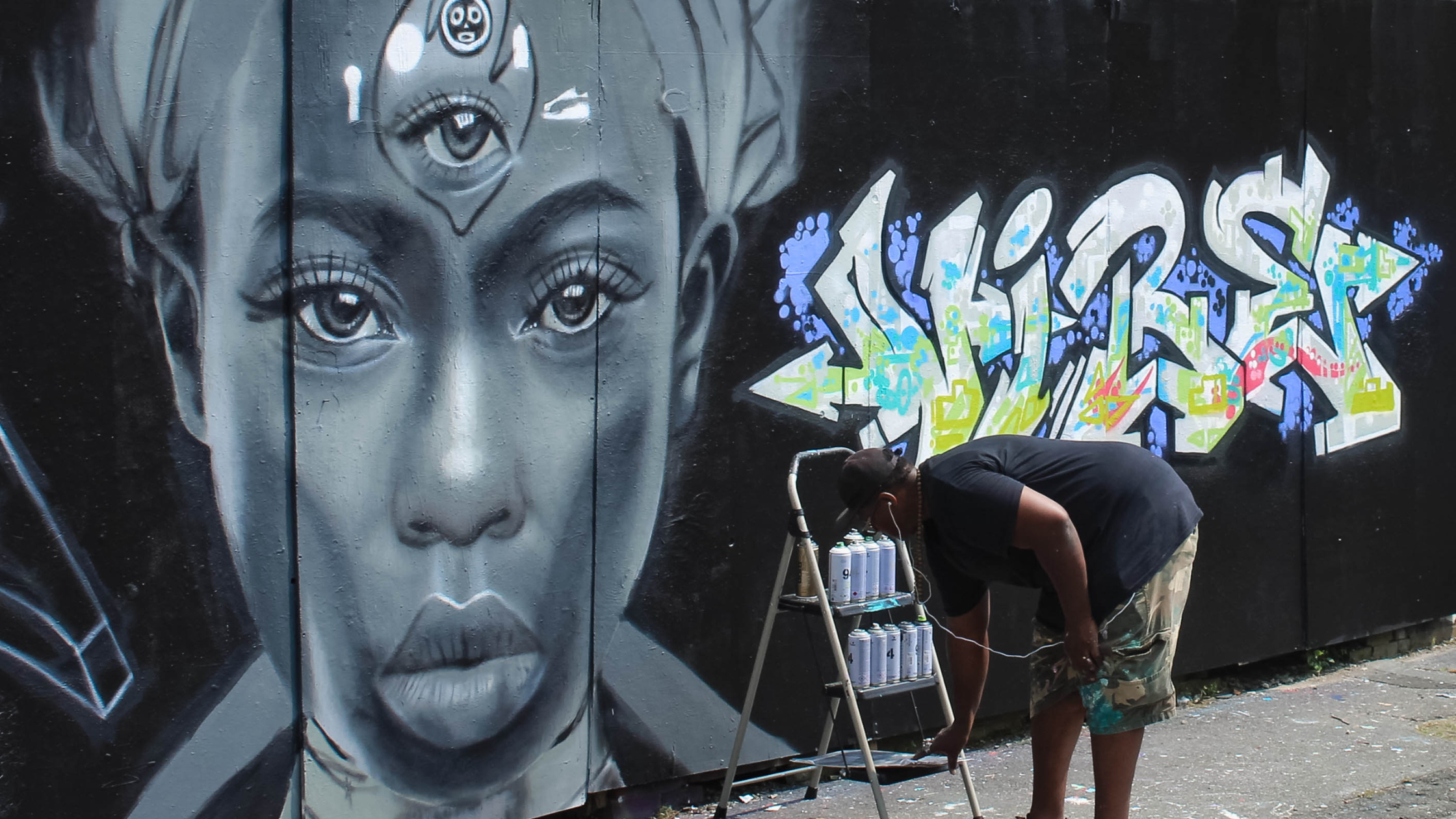 August in New Bedford 3rd Eye Open Hip Hop Festival art on the free wall.